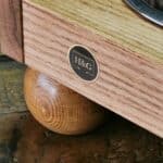 A small solid oak dog feeding station